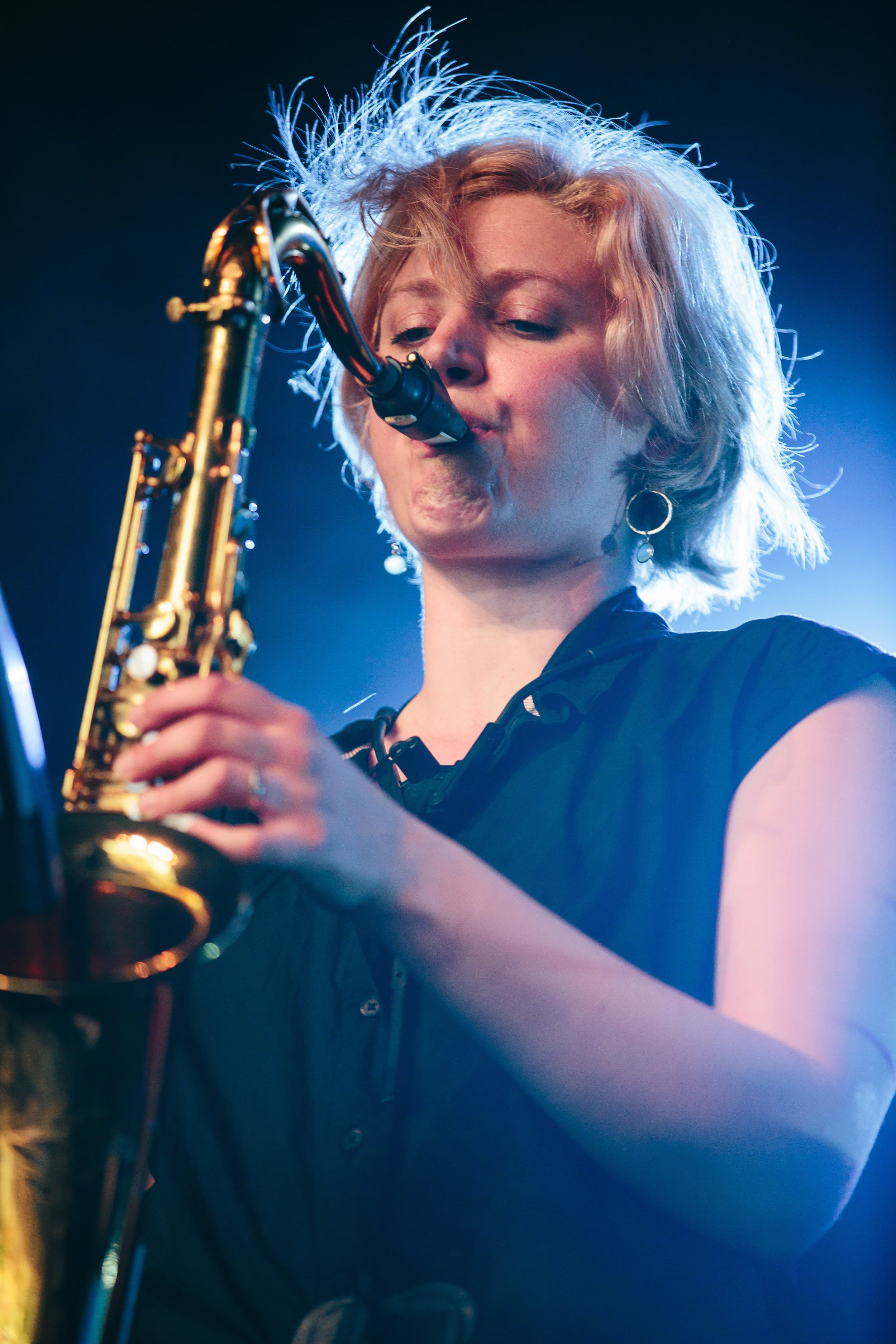 Claire Devlin portrait with tenor saxophone